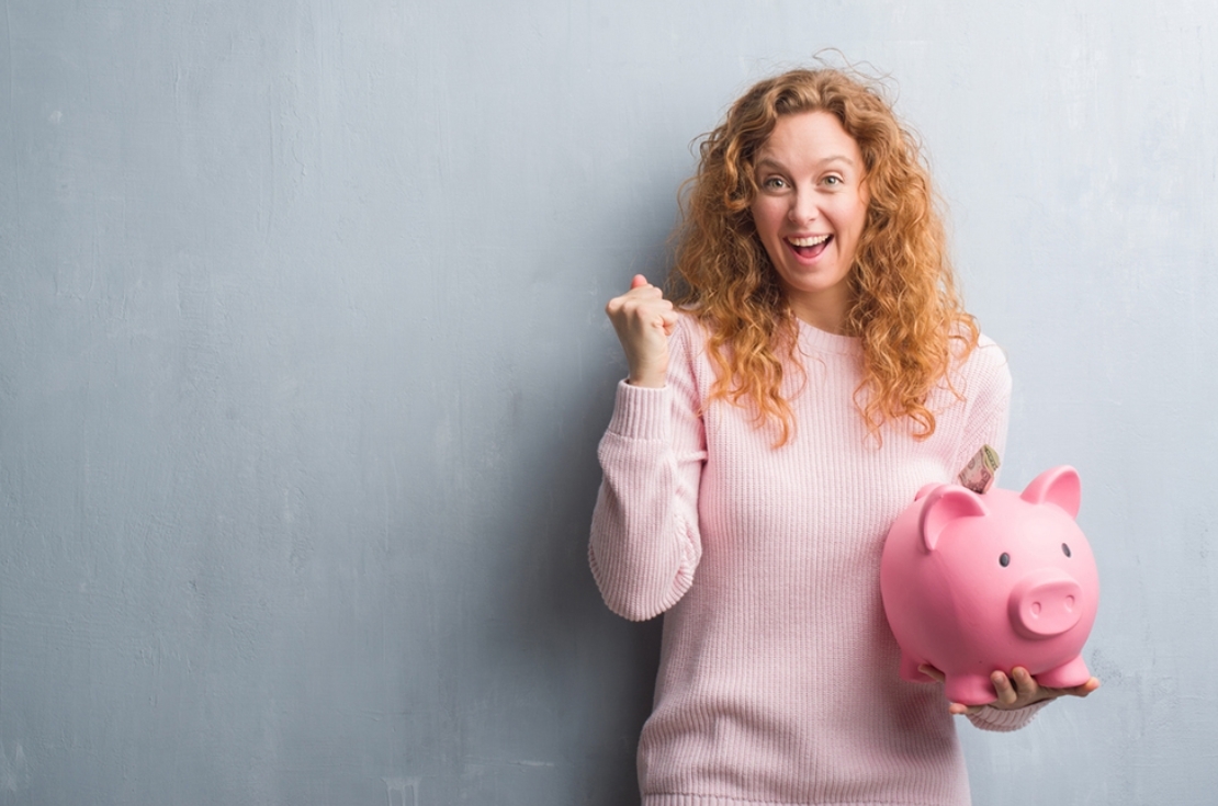 Woman holding piggybank